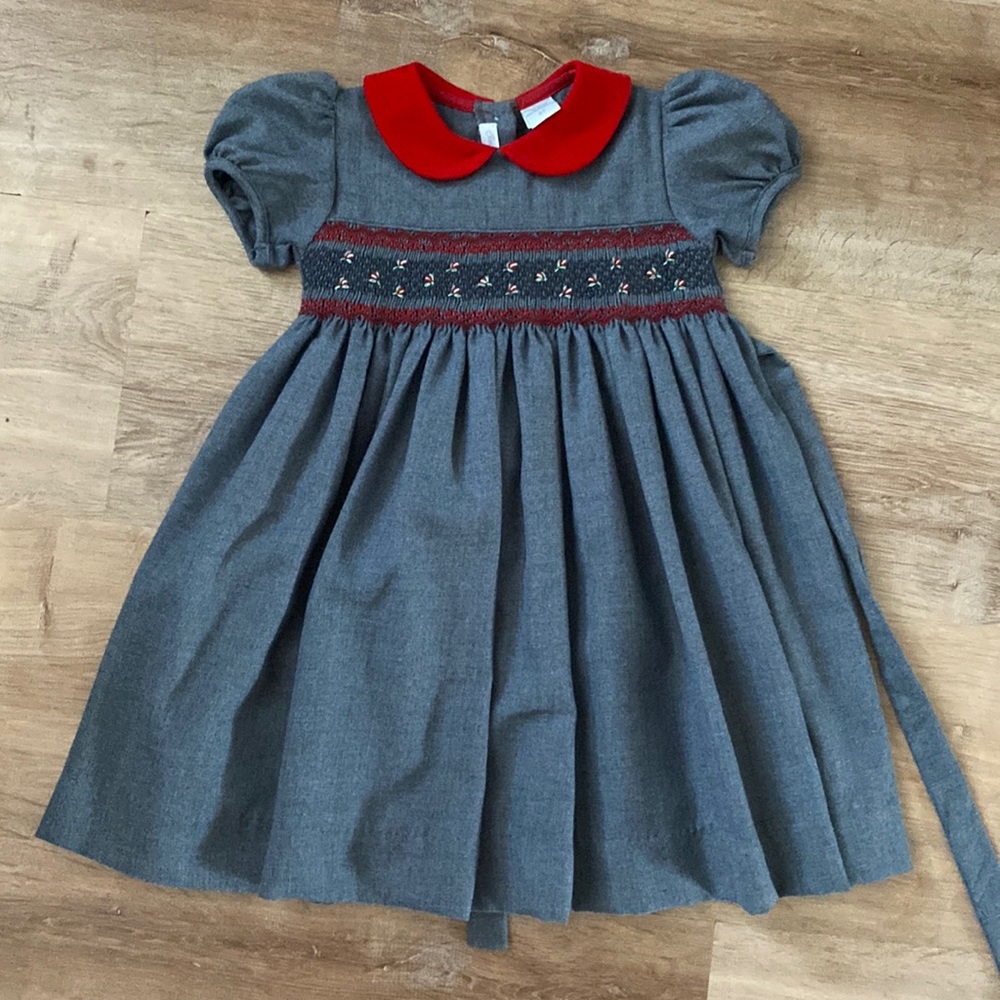 Carriage Boutique grey flannel smocked dress with red rose embroidery.
